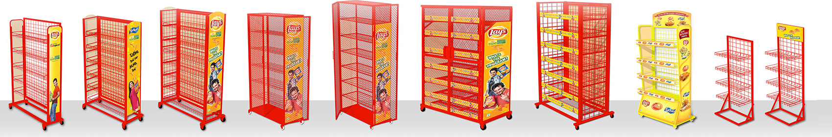 A range of red wire floor display stands, several with printed headers